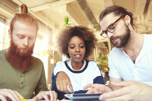 three-creative-people-having-discussion-cafe-african-woman-explaining-her-vision-pointing-screen-touch-pad-bearded-man-glasses-listening-attentively-redhead-partner-making-notes (1) three-creative-people-having-discussion-cafe-african-woman-explaining-her-vision-pointing-screen-touch-pad-bearded-man-glasses-listening-attentively-redhead-partner-making-notes (1)